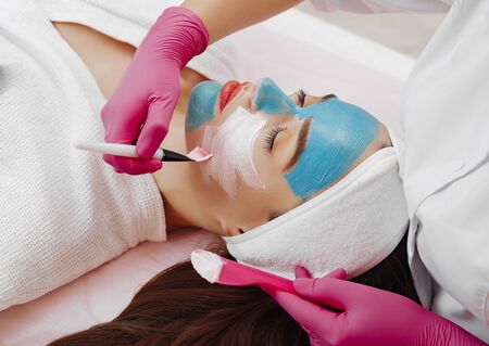 Spa Woman applying Facial cleansing Mask.の写真素材