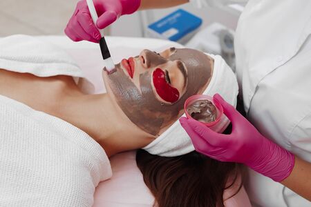Spa Woman applying Facial cleansing Mask.の写真素材