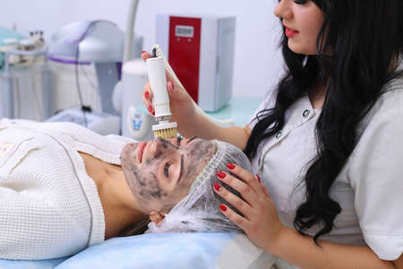 Hardware cosmetology. Cleaning the skin with a brush.の写真素材