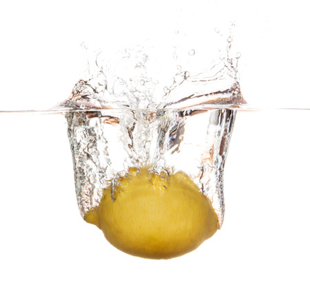 Lemon falling underwater. Clean and fresh water.の写真素材