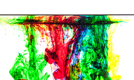 Color clouds flowing underwater isolated on a white backgroundの写真素材