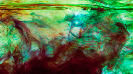Color clouds flowing underwater isolated on a white backgroundの写真素材