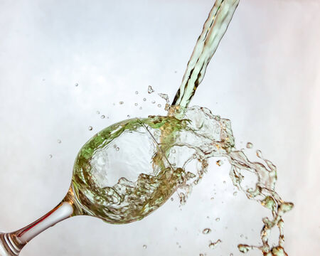 Interesting way for pouring green drink in a glassの写真素材