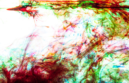 Color clouds flowing underwater isolated on a white backgroundの写真素材