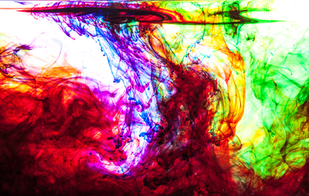 Color clouds flowing underwater isolated on a white backgroundの写真素材