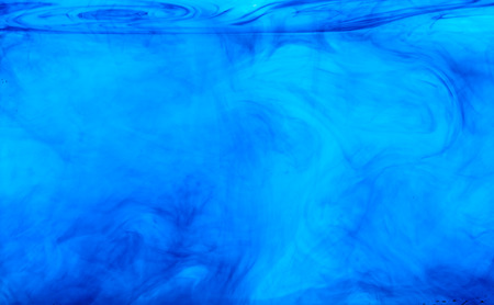 Color clouds flowing underwater isolated on a white backgroundの写真素材