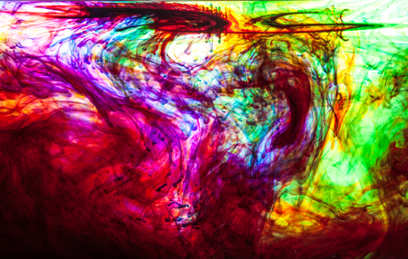 Color clouds flowing underwater isolated on a white backgroundの写真素材