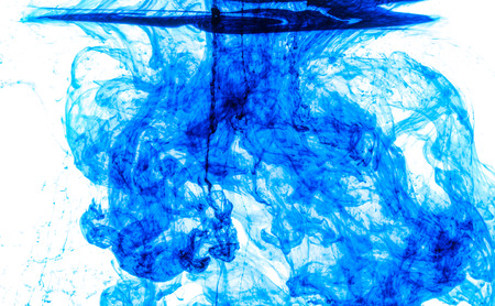 Color clouds flowing underwater isolated on a white backgroundの写真素材