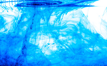 Color clouds flowing underwater isolated on a white backgroundの写真素材