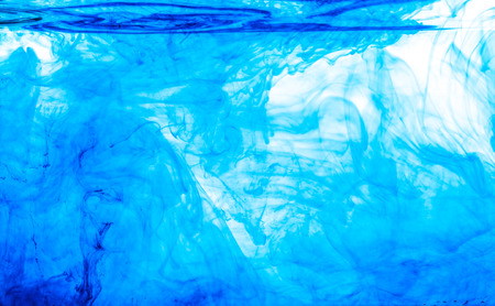 Color clouds flowing underwater isolated on a white backgroundの写真素材