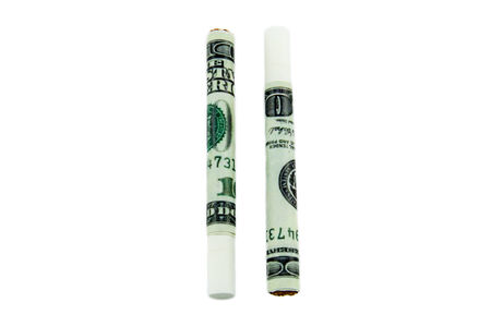 Cigarettes made from 100 dollar bills isolated on a white backgroundの写真素材