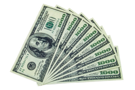 One thousand dollar bills aranged as fan on a white backgroundの写真素材