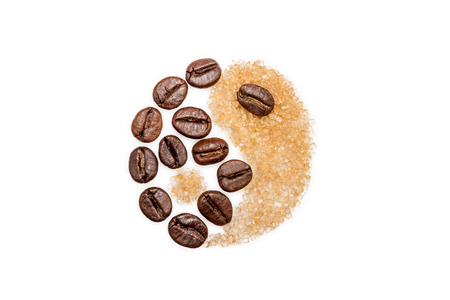 Yin and Yang Symbol made from coffee beans and brown sugarの写真素材