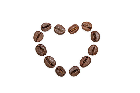 Heart shape made from coffee beansの写真素材