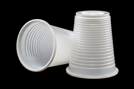 Two plastic cups isolated on black backgroundの写真素材