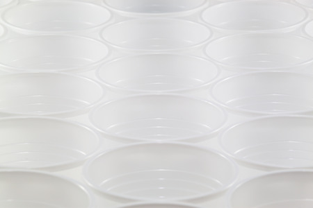 Lots of white plastic cups. Shallow depth of field.の写真素材