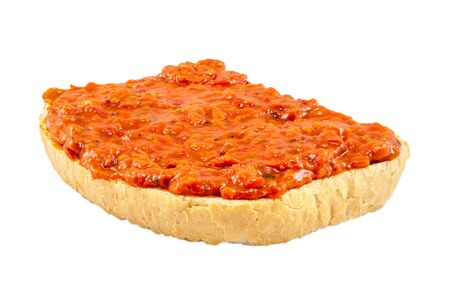 Traditional Bulgarian relish called Lutenica. Spread on a slice of white bread.の写真素材