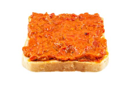 Traditional Bulgarian relish called Lutenica. Spread on a slice of white bread.の写真素材