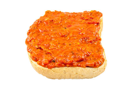 Traditional Bulgarian relish called Lutenica. Spread on a slice of white bread.の写真素材