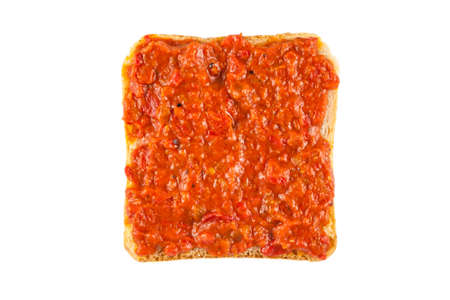 Traditional Bulgarian relish called Lutenica. Spread on a slice of white bread.の写真素材