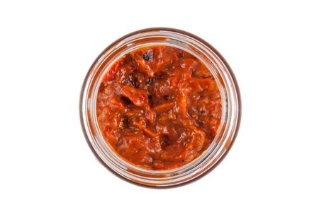 Small jar of Bulgarian traditional relish called Lutenicaの写真素材