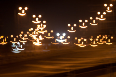 Smiley face qustom bokeh. City street lights.の写真素材