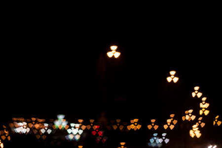 Radiation sign qustom bokeh. City street lights.の写真素材