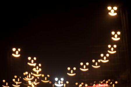 Smiley face qustom bokeh. City street lights.