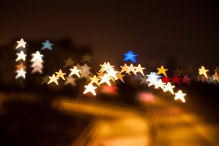 Star shape qustom bokeh. City street lights.の写真素材