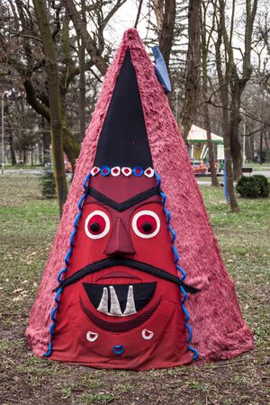 YAMBOL, BULGARIA - MARCH 08, 2015 - Kukerlandia - mask festival and masquerade games 08 March 2015. Bulgarian traditional dances and costumes called Kukeri.のeditorial素材