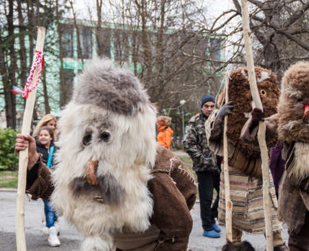 YAMBOL, BULGARIA - MARCH 08, 2015 - Kukerlandia - mask festival and masquerade games 08 March 2015. Bulgarian traditional dances and costumes called Kukeri.のeditorial素材