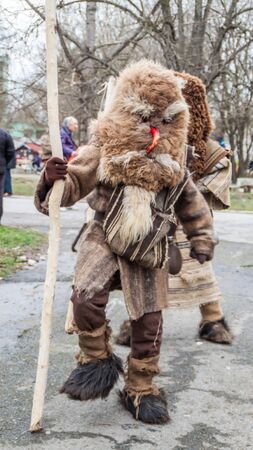 YAMBOL, BULGARIA - MARCH 08, 2015 - Kukerlandia - mask festival and masquerade games 08 March 2015. Bulgarian traditional dances and costumes called Kukeri.のeditorial素材