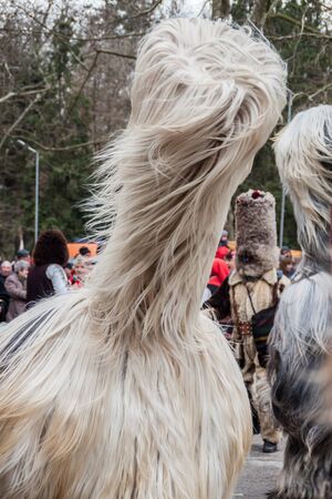 YAMBOL, BULGARIA - MARCH 08, 2015 - Kukerlandia - mask festival and masquerade games 08 March 2015. Bulgarian traditional dances and costumes called Kukeri.のeditorial素材