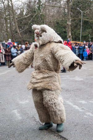 YAMBOL, BULGARIA - MARCH 08, 2015 - Kukerlandia - mask festival and masquerade games 08 March 2015. Bulgarian traditional dances and costumes called Kukeri.のeditorial素材