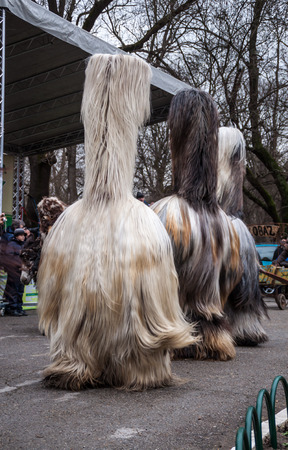 YAMBOL, BULGARIA - MARCH 08, 2015 - Kukerlandia - mask festival and masquerade games 08 March 2015. Bulgarian traditional dances and costumes called Kukeri.のeditorial素材