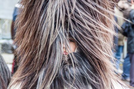 YAMBOL, BULGARIA - MARCH 08, 2015 - Kukerlandia - mask festival and masquerade games 08 March 2015. Bulgarian traditional dances and costumes called Kukeri.のeditorial素材