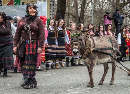 YAMBOL, BULGARIA - MARCH 08, 2015 - Kukerlandia - mask festival and masquerade games 08 March 2015. Bulgarian traditional dances and costumes called Kukeri.のeditorial素材
