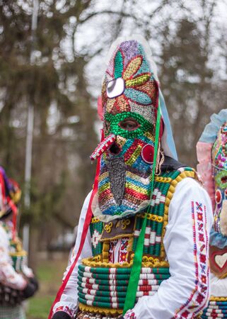 YAMBOL, BULGARIA - MARCH 08, 2015 - Kukerlandia - mask festival and masquerade games 08 March 2015. Bulgarian traditional dances and costumes called Kukeri.のeditorial素材