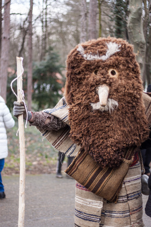YAMBOL, BULGARIA - MARCH 08, 2015 - Kukerlandia - mask festival and masquerade games 08 March 2015. Bulgarian traditional dances and costumes called Kukeri.のeditorial素材