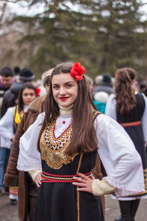 YAMBOL, BULGARIA - MARCH 08, 2015 - Kukerlandia - mask festival and masquerade games 08 March 2015. Bulgarian traditional dances and costumes called Kukeri.のeditorial素材