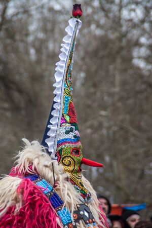 YAMBOL, BULGARIA - MARCH 08, 2015 - Kukerlandia - mask festival and masquerade games 08 March 2015. Bulgarian traditional dances and costumes called Kukeri.のeditorial素材