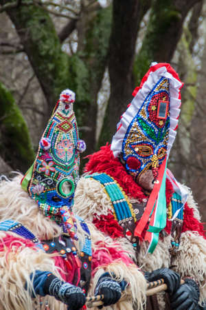 YAMBOL, BULGARIA - MARCH 08, 2015 - Kukerlandia - mask festival and masquerade games 08 March 2015. Bulgarian traditional dances and costumes called Kukeri.のeditorial素材