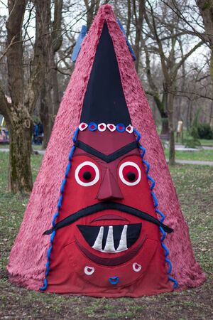 YAMBOL, BULGARIA - MARCH 08, 2015 - Kukerlandia - mask festival and masquerade games 08 March 2015. Bulgarian traditional dances and costumes called Kukeri.のeditorial素材