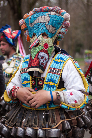 YAMBOL, BULGARIA - MARCH 08, 2015 - Kukerlandia - mask festival and masquerade games 08 March 2015. Bulgarian traditional dances and costumes called Kukeri.のeditorial素材