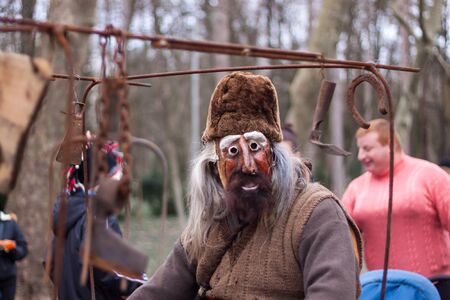 YAMBOL, BULGARIA - MARCH 08, 2015 - Kukerlandia - mask festival and masquerade games 08 March 2015. Bulgarian traditional dances and costumes called Kukeri.のeditorial素材