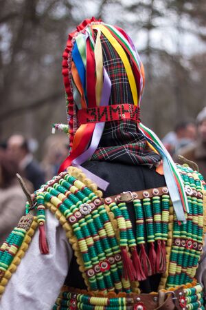 YAMBOL, BULGARIA - MARCH 08, 2015 - Kukerlandia - mask festival and masquerade games 08 March 2015. Bulgarian traditional dances and costumes called Kukeri.のeditorial素材