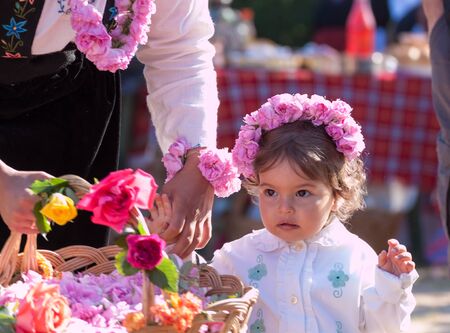 GORNO CHERKOVISHTE, BULGARIA - MAY 31, 2015 - Rose picking ritual in Gorno Izvorovo village. People dressed up in a traditional folklore costumes sing and dance for health and succesful harvest of the Bulgarian Roses.のeditorial素材