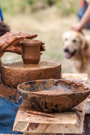 Young woman making pottery