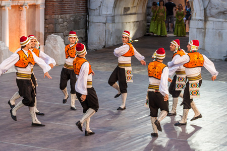 PLOVDIV, BULGARIA - AUGUST 06, 2015 - 21-st international folklore festival in Plovdiv, Bulgaria. The folklore group from Turkey dressed in traditional clothing is preforming Turkish national dances.のeditorial素材