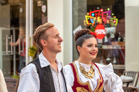 PLOVDIV, BULGARIA - AUGUST 06, 2015 - 21-st international folklore festival in Plovdiv, Bulgaria. The folklore group from Serbia dressed in traditional clothing is preforming Serbian national dances.のeditorial素材